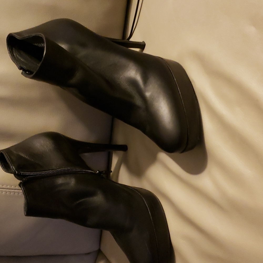 Black leather platform ankle boots by Stuart Weitz